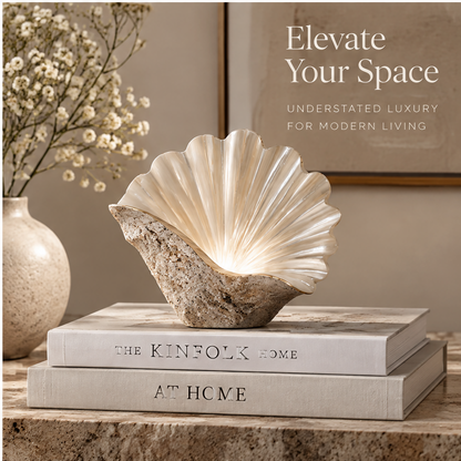 Fan shell decor styled on books beside a neutral vase